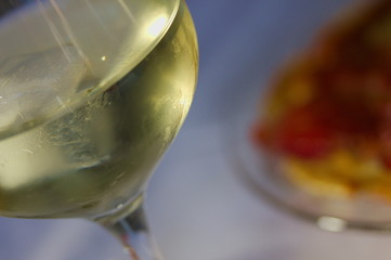 Close up of a glass of white wine on a table