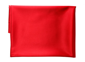 folded piece of bright red satin fabric isolated on white background, top view