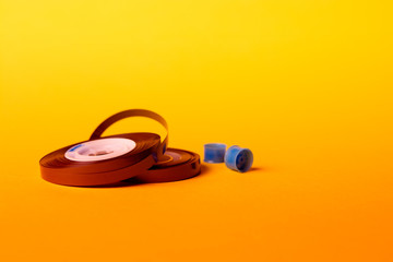 music tape over yellow background