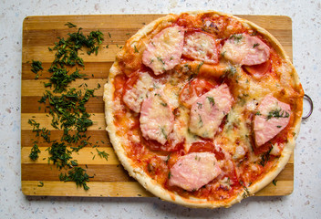 greens and pizza on the board