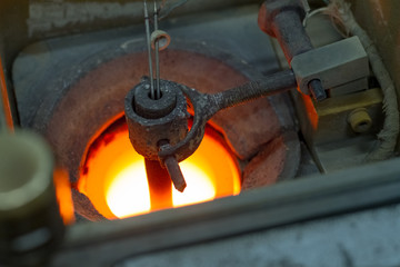 Preparation for smelting silver jewelry in a workshop for the manual production of jewelry