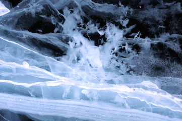 Sun rays are refracted by the transparent ice of Lake Baikal. cracks at different depths create a bizarre web