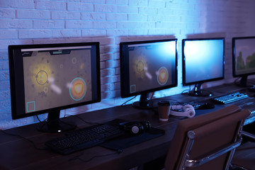 Internet cafe with modern computers for playing video games