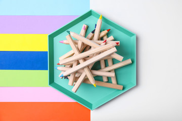 Flat lay composition with pencils on color background