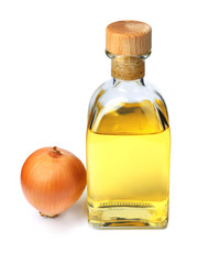 Glass bottle of onion syrup and fresh ingredient on white background