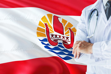 Polynesian Doctor standing with stethoscope on French Polynesia flag background. National...