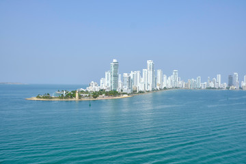 Naklejka premium Scenic view of downtown of Cartagena de Indias - old historical touristic town in Colombia. Beautiful summer sunny look of skyline of skyscrapers on coast of Caribbean sea in country in South America
