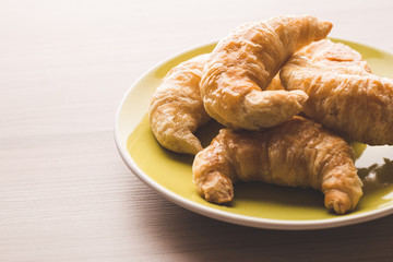 Croissant on a green dish