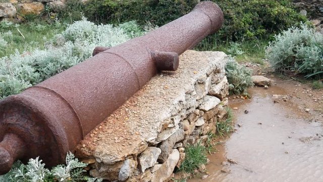 old cannon on the Sentier des Douaniers (Custom Officers Route), a famous coastal path for hikers, Corsica, France