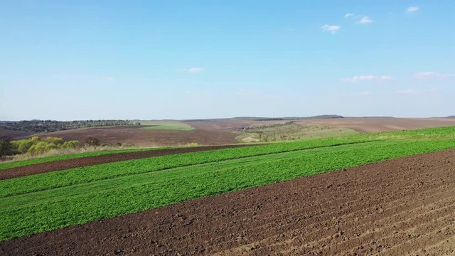 Aerial Europe Valley Farming crops agricultural arable farmland vegetation water field industry investment nature, early spring.
