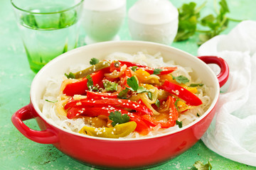 Baked bell peppers with rice noodles in Asian style.