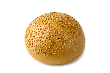 Bun for burger with sesame seeds on white