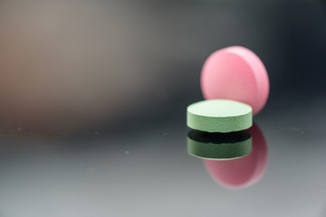Different types of multi-colored pills. Photographed closeup of pharmaceuticals.