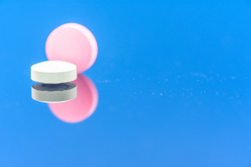 Different types of multi-colored pills. Photographed closeup of pharmaceuticals.