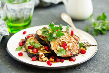 Fried eggplants with pomegranate sauce and nuts.