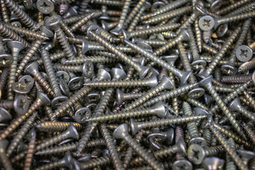 screws on wood and metal, black silver yellow