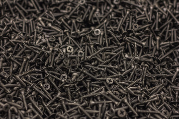 screws on a black background