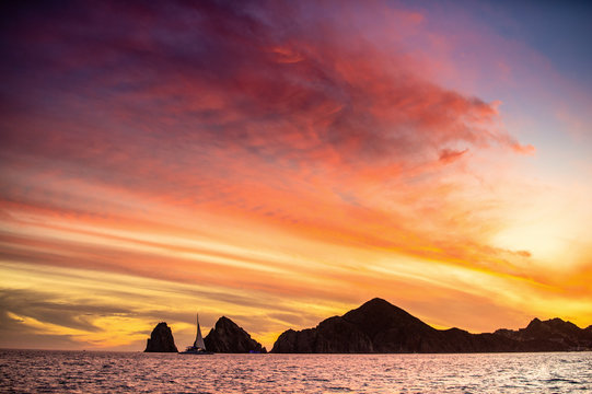 Beautiful Sunset of Seascape with Mountains silhouets. Sea off the Coast of Cabo San Lucas. Gulf of California (also known as the Sea of Cortez, Sea of Cortes. Mexico. © Uryadnikov Sergey