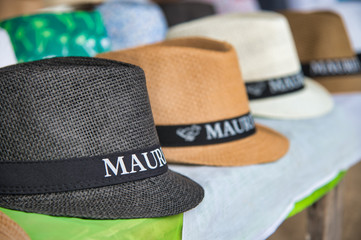 MAURITIUS - MAY 2, 2019: Straw hats on sale in a tourist shop. Mauritius is a famous tourist...