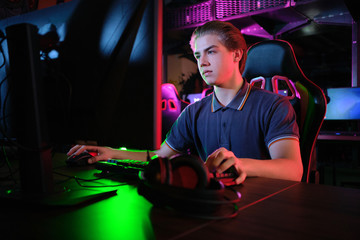 Cyber sport. Team play. Professional cybersport player training or playing online game on his PC