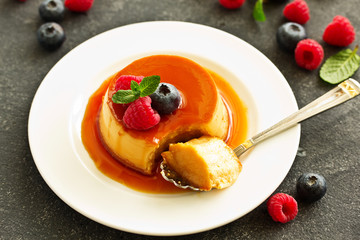 delicious dessert creme brulee with berries.