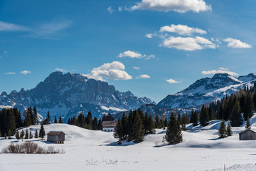 Panorama of Dolomites Alps, Val Gardena, Italy with some huts in the foreground