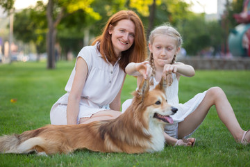 mother, daughter and dog