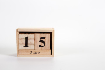 Wooden calendar June 15 on a white background