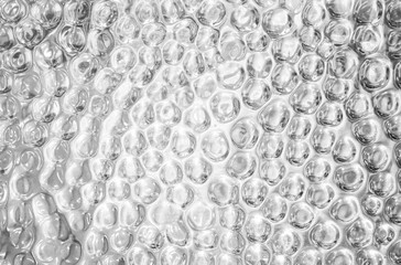 Shiny silver metal textured background with highlights and circles