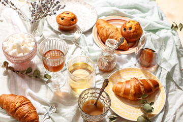 Breakfast Croissants and muffins with currants with coffee.