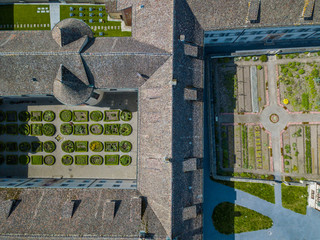 Obraz premium Aerial view of monastery courtyard with garden.