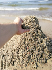 Sandcastle on the sandy beach in Lithuania