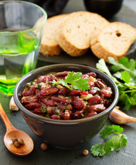 Stewed red beans with spices and cilantro, hot pepper. Lobio. Chile con carne.