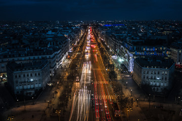 Champs-Élysées by night with the city of Paris