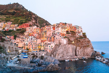 Fototapeta na wymiar Stunning view of the beautiful and cozy village of Manarola in the Cinque Terre Reserve at sunset. Liguria region of Italy.