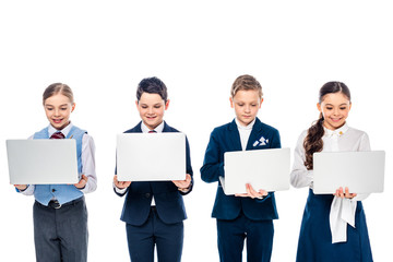schoolchildren pretending to be businesspeople using laptops Isolated On White
