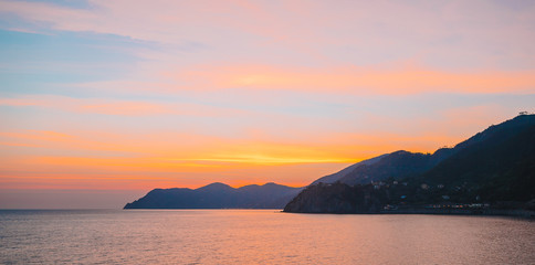 Stunning view of the beautiful and cozy village of Manarola in the Cinque Terre Reserve at sunset. Liguria region of Italy.