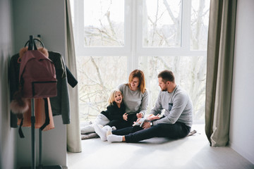 Fototapeta premium mom and dad are having fun with a child