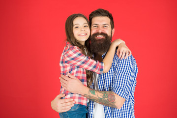 Celebrate fathers day. Family values concept. Family bonds. Friendly relations. Father hipster and his daughter. Happy moment. Man bearded father and cute little girl daughter on red background