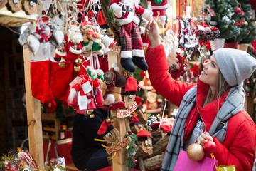 Fototapeta na wymiar Girl shopping Christmas decorations