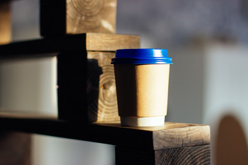 Paper Cup with blue lid for coffee or tea.