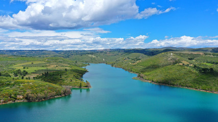 Fototapeta na wymiar Aerial drone panoramic view of famous dam and lake of Marathon with beautiful clouds, North Attica, Greece