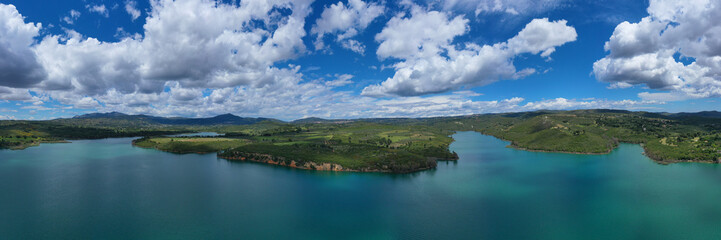Aerial drone panoramic view of famous dam and lake of Marathon with beautiful clouds, North Attica, Greece
