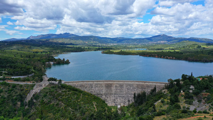 Obraz na płótnie Canvas Aerial drone panoramic view of famous dam and lake of Marathon with beautiful clouds, North Attica, Greece