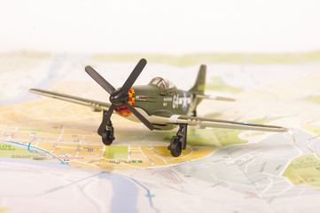 Old WWII model plane placed on the city map