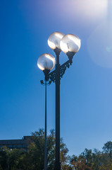 Classic style city lamppost at sunset, close up