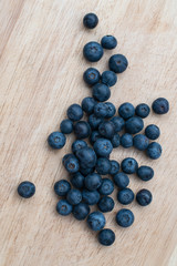 Blueberries on a wooden background. Blue berries, healthy food on dark table mockup, berry for smoothie on vintage rustic country board, copy space for text