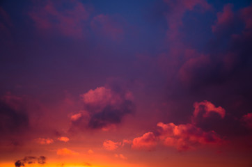 Obraz premium Beautiful colorful cloudy sky at the sunset with blue and orange and purple tones background texture