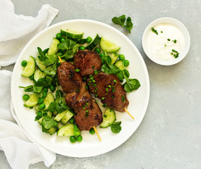 Beef kebab with cucumber and green pea salad. Healthy food.