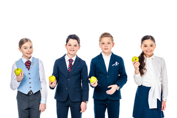 smiling schoolchildren pretending to be businesspeople with apples Isolated On White